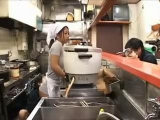 Japanese Girl Cooks Delicious Meal at Restaurant